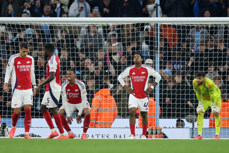 MANCHESTER, ENGLAND - SEPTEMBER 22: Gabriel, Myles Lewis-Skelly and David Raya of Arsenal look dejected following the Premier League match between Manchester City FC and Arsenal FC at Etihad Stadium on September 22, 2024 in Manchester, England. (Photo by Carl Recine/Getty Images)