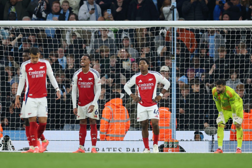 MANCHESTER, ENGLAND - SEPTEMBER 22: Gabriel, Myles Lewis-Skelly and David Raya of Arsenal look dejected following the Premier League match between Manchester City FC and Arsenal FC at Etihad Stadium on September 22, 2024 in Manchester, England. (Photo by Carl Recine/Getty Images)