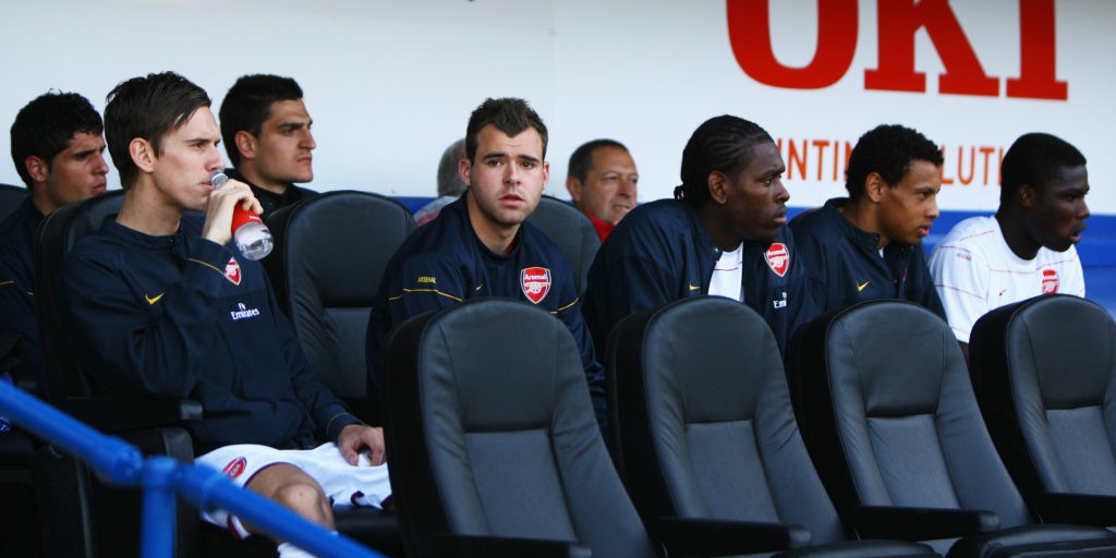 PORTSMOUTH, UNITED KINGDOM - MAY 02: (L-R) Fran Marida, Mark Randall, Vito Mannone, Amaury Bischoff, Jay Thomas, Francis Coquelin and Emmanuel Frimpong of Arsenal look on from the bench prior to the Barclays Premier League match between Portsmouth and Arsenal at Fratton Park on May 2, 2009 in Portsmouth, England. (Photo by Paul Gilham/Getty Images)