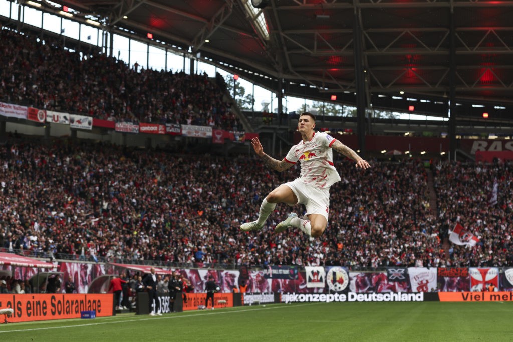 LEIPZIG, GERMANY - SEPTEMBER 28: Benjamin Sesko of RB Leipzig celebrates after scoring the team's first goal during the Bundesliga match between RB Leipzig and FC Augsburg at Red Bull Arena on September 28, 2024 in Leipzig, Germany. (Photo by Maja Hitij/Getty Images)