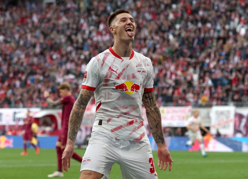 LEIPZIG, GERMANY - SEPTEMBER 28: Benjamin Sesko of RB Leipzig celebrates scoring his team's second goal during the Bundesliga match between RB Leipzig and FC Augsburg at Red Bull Arena on September 28, 2024 in Leipzig, Germany. (Photo by Maja Hitij/Getty Images)