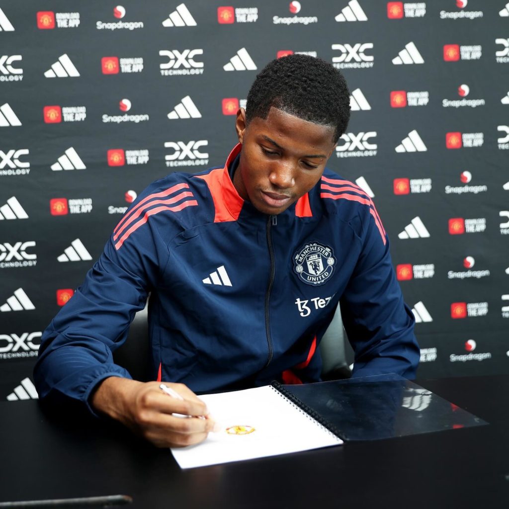 Chido Martin Obi signing for Manchester United (Photo via Martin Obi on Instagram)