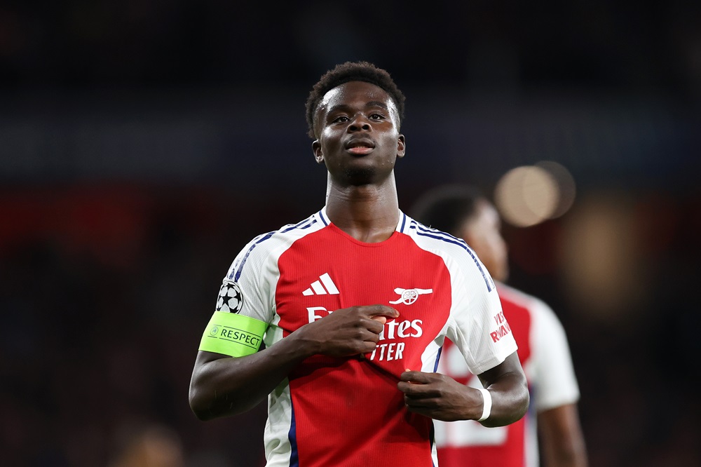 LONDON, ENGLAND: Bukayo Saka of Arsenal celebrates scoring his team's second goal during the UEFA Champions League 2024/25 League Phase MD2 match between Arsenal FC and Paris Saint-Germain at Emirates Stadium on October 01, 2024. (Photo by Julian Finney/Getty Images)