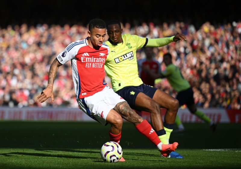 LONDON, ENGLAND - OCTOBER 05: Gabriel Jesus of Arsenal runs with the ball under pressure from Joe Aribo of Southampton during the Premier League match between Arsenal FC and Southampton FC at Emirates Stadium on October 05, 2024 in London, England. (Photo by Clive Mason/Getty Images)