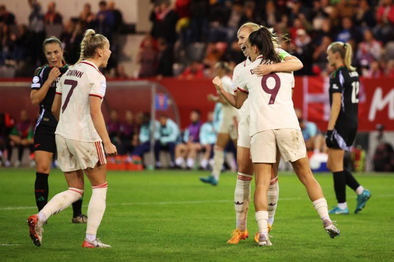 MUNICH, GERMANY - OCTOBER 09: Glodis Perla Viggosdottir of Bayern Munich celebrates scoring her team's first goal with teammates Jovana Damnjanovic and Giulia Gwinn during the UEFA Women's Champions League match between FC Bayern München and Arsenal FC at FC Bayern Campus on October 09, 2024 in Munich, Germany. (Photo by Adam Pretty/Getty Images)