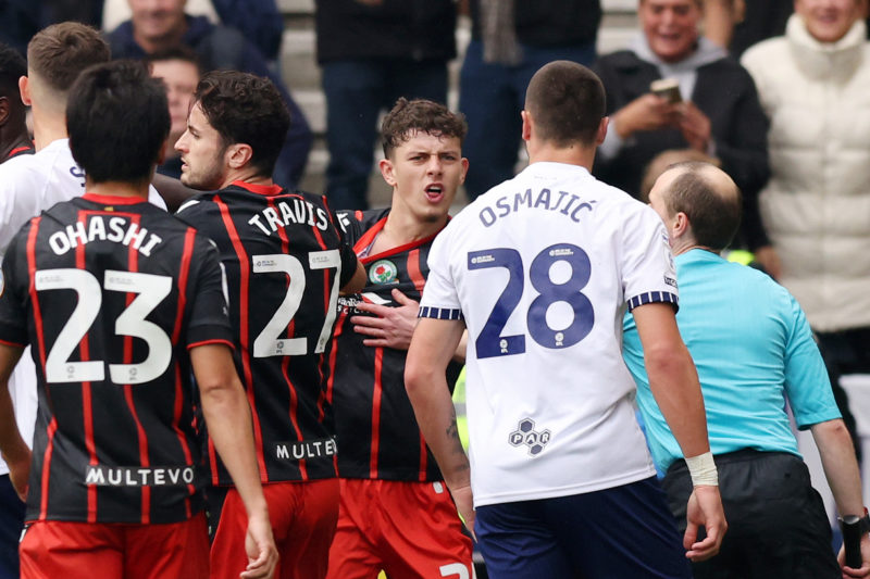 PRESTON, ENGLAND - SEPTEMBER 22: Owen Beck confronts Preston's Milutin Osmajic about an alleged bite from the Preston player during the Sky Bet Championship match between Preston North End FC and Blackburn Rovers FC at Deepdale on September 22, 2024 in Preston, England. (Photo by Gary Oakley/Getty Images)