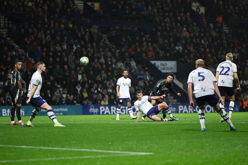 PRESTON, ENGLAND: Ethan Nwaneri of Arsenal scores his team's second goal during the Carabao Cup Fourth Round match between Preston North End and Arsenal at Deepdale on October 30, 2024. (Photo by Matt McNulty/Getty Images)