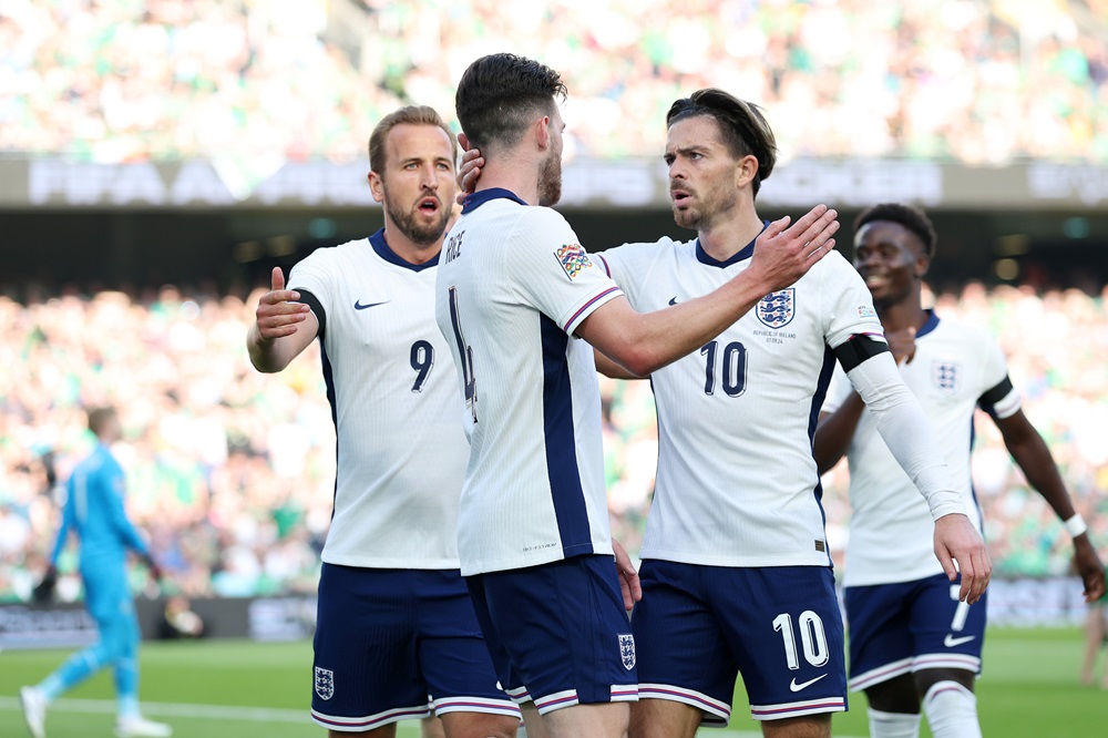 DUBLIN, IRELAND: Declan Rice of England celebrates scoring his team's first goal with teammate Jack Grealish during the UEFA Nations League 2024/25 League B Group B2 match between Republic of Ireland and England at Aviva Stadium on September 07, 2024. (Photo by Carl Recine/Getty Images)