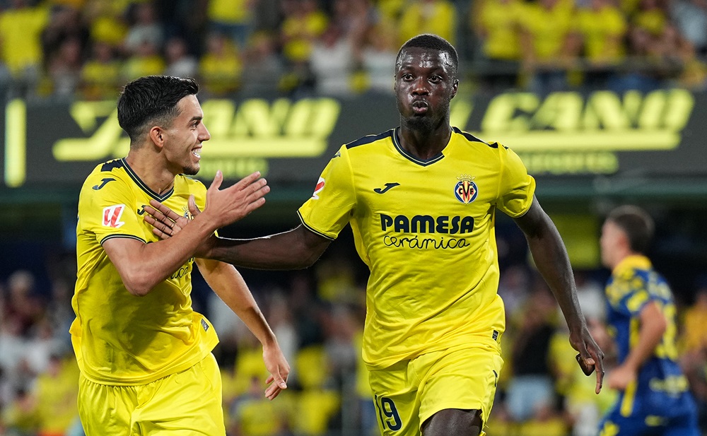 VILLARREAL, SPAIN: Nicolas Pepe of Villarreal CF celebrates scoring his team's first goal with teammate Ilias Akhomach during the LaLiga match between Villarreal CF and UD Las Palmas at Estadio de la Ceramica on September 30, 2024. (Photo by Aitor Alcalde/Getty Images)