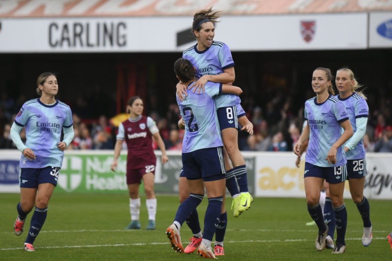 DAGENHAM, ENGLAND - OCTOBER 20: Mariona Caldentey of Arsenal celebrates scoring her team's first goal with teammate Emily Fox during the Barclays Women's Super League match between West Ham United and Arsenal at Chigwell Construction Stadium on October 20, 2024 in Dagenham, England. (Photo by Jaimi Joy/Getty Images)