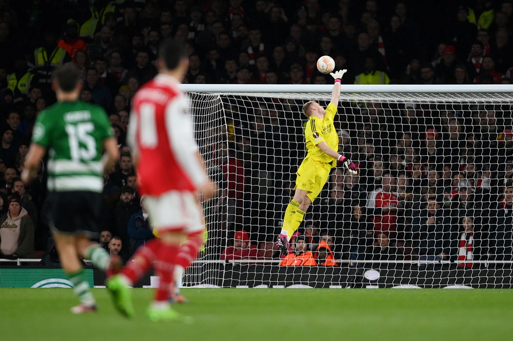 LONDON, ENGLAND: Aaron Ramsdale of Arsenal fails to save a shot from Pedro Goncalves of Sporting CP as he scores their side's first goal during the UEFA Europa League round of 16 leg two match between Arsenal FC and Sporting CP at Emirates Stadium on March 16, 2023. (Photo by Mike Hewitt/Getty Images)