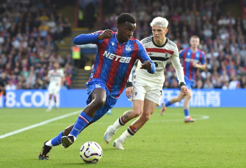 LONDON, ENGLAND - SEPTEMBER 21: Eddie Nketiah of Crystal Palaceruns with the ball under pressure from Alejandro Garnacho of Manchester United during the Premier League match between Crystal Palace FC and Manchester United FC at Selhurst Park on September 21, 2024 in London, England. (Photo by Harriet Lander/Getty Images)