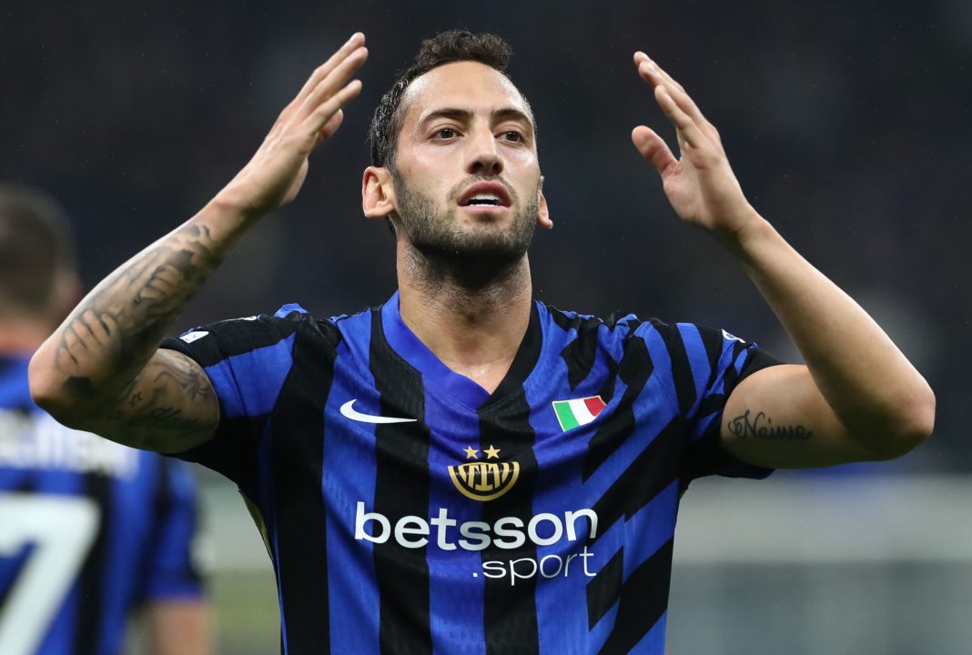 MILAN, ITALY - OCTOBER 01: Hakan Calhanoglu of FC Internazionale celebrates scoring his team's first goal during the UEFA Champions League 2024/25 League Phase MD2 match between FC Internazionale Milano and FK Crvena Zvezda at Stadio San Siro on October 01, 2024 in Milan, Italy. (Photo by Marco Luzzani/Getty Images)