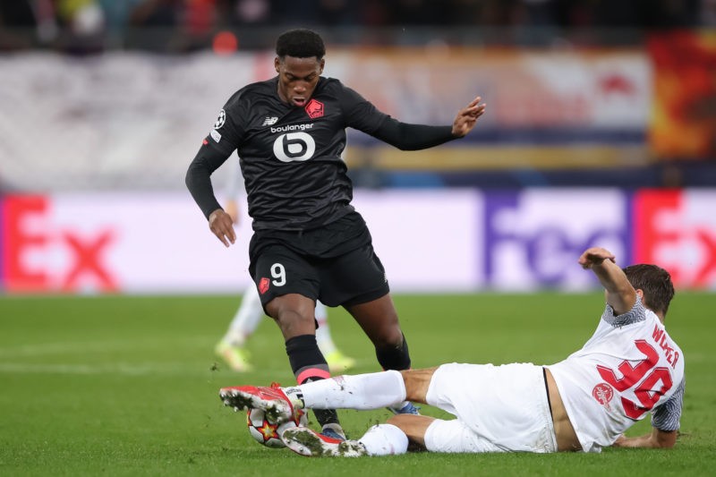 SALZBURG, AUSTRIA - SEPTEMBER 29: Jonathan David of Lille OSC is tackled by Maximilian Woeber of FC Red Bull Salzburg during the UEFA Champions League group G match between FC Red Bull Salzburg and Lille OSC at Stadion Salzburg on September 29, 2021 in Salzburg, Austria. (Photo by Christian Kaspar-Bartke/Getty Images)