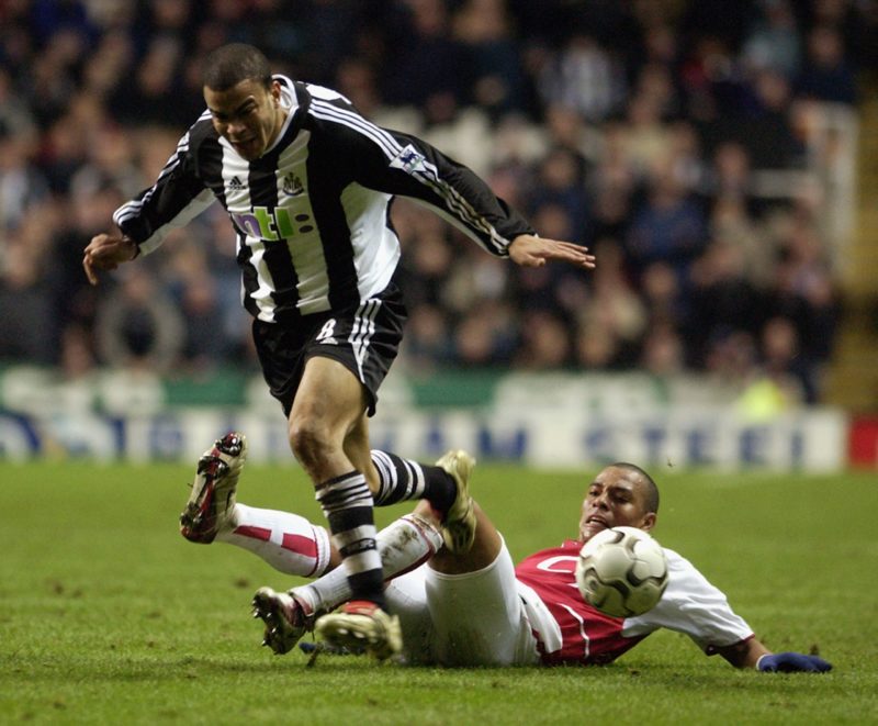 NEWCASTLE - FEBRUARY 9: Kieron Dyer of Newcastle United is tackled by Gilberto Silva of Arsenal during the FA Barclaycard Premiership match held on February 9, 2003 at St James Park, in Newcastle, England. The match ended in a 1-1 draw. (Photo by Ross Kinnaird/Getty Images)